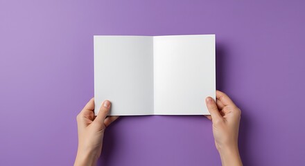 Holding Open Blank Greeting Card with Hands on Purple Background
