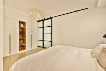 A stylish, serene bedroom featuring sleek furniture, ample storage, and a soft color palette, designed for comfort and relaxation.