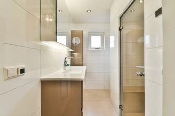 Sleek and contemporary bathroom featuring clean lines, neutral colors, and modern fixtures that enhance the space's aesthetic appeal.