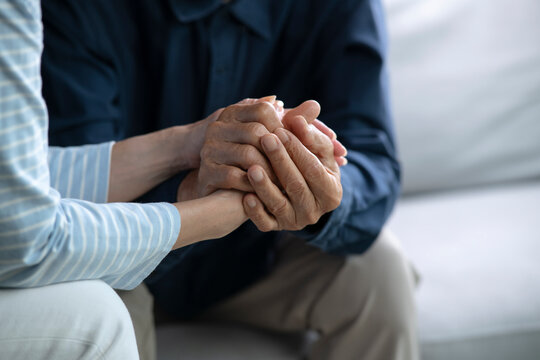 Senior couple holding hands for love, care and trust in home, connection and motivation for mental health.People, comfort and partner for help with kindness, bonding and support for grief. - Powered by Adobe
