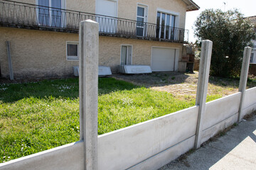 cement panel wall with concrete pillar barrier being installed and mounted on the house wall design...