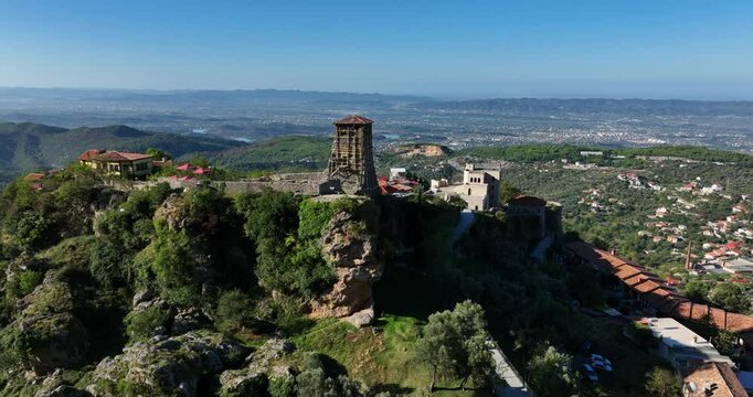 Stunning castle tower on a hill with beautiful sunny landscape around in the historic Kruja, Albania.