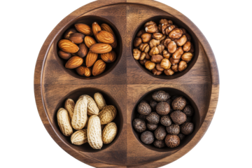 Variety of mixed nuts organized in a wooden bowl with sections on white photo background