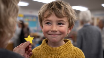 Smiling boy receiving a star award in a classroom setting.