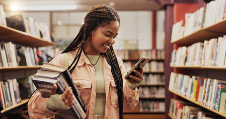 Education, phone and student black woman in library to search for books or study material. App, learning and social media with happy person on college or university campus for school scholarship