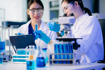 Fototapeta premium Biologist taking experiment with plants working in biochemistry laboratory.