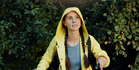 Trekking, walking and woman explore forest with flashlight, travel adventure and holiday...