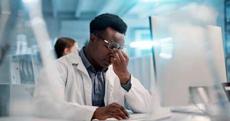 Doctor, man and computer with headache in laboratory, medical compliance and burnout for deadline....