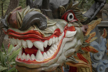 Close up view of a colorful dragon head sculpture made in Chinese style