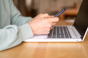 Mature Female Interacting With Artificial Intelligence Chatbot On Laptop And Smartphone For Online Customer Support In Financial And Travel Services