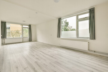 A light-filled minimalist interior featuring large windows, clean lines, and a serene atmosphere inviting tranquility and creativity.