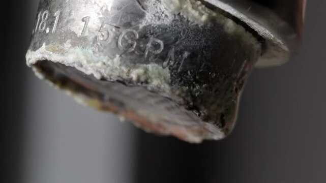 Close View of Hard Water Scale on Metal Tap Fixture