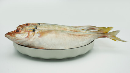 Fish yellowtail or ikan selar isolated on white background