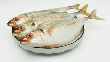 Fish yellowtail or ikan selar isolated on white background