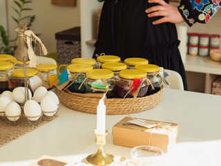 Waist-Down Close-Up of Woman in Black Embroidered Dress at Easter Egg Dye Pysanka Workshop Mood