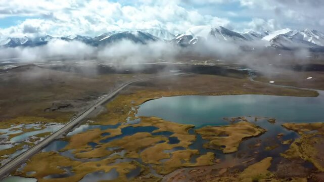 Drone footage shows the stunning Arabel Plateau in the Issyk-Kul region of Kyrgyzstan, capturing the vast alpine landscape and rugged terrain.