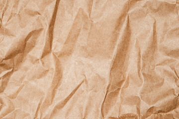 Textured Brown Cardboard Paper With Close-up View Creases and Folds Creates an Organic Visual Effect, Ideal for Backgrounds in Art and Design Projects. This Natural Material Enhances Creativity.