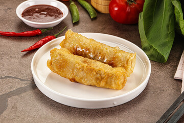 Vietnamese stuffed spring roll served sauce