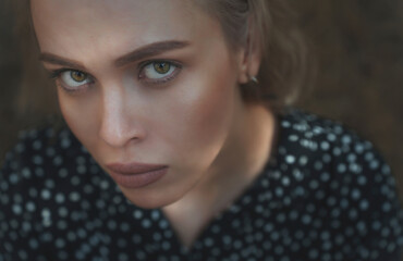 Serious woman with intense gaze looking at camera