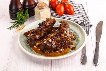 Prepared tasty beef ribs with sauce