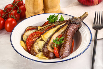 Baked tomato with mozzarella and tomato