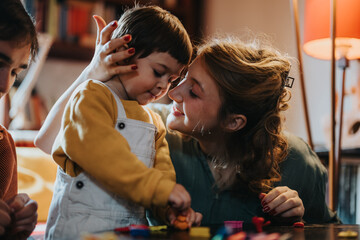 A touching moment of a mother lovingly holding her young child in a comforting embrace, depicting...