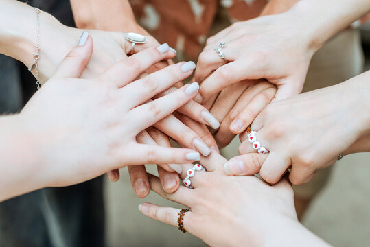 Diverse hands together showing unity and friendship