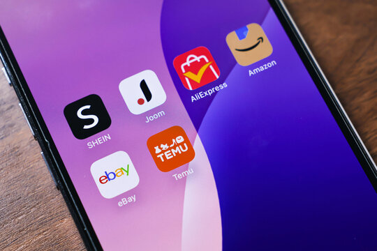 Poznan, Poland - March 26, 2025: Smartphone screen with shopping apps SHEIN, Joom, AliExpress, Amazon, eBay, and Temu installed