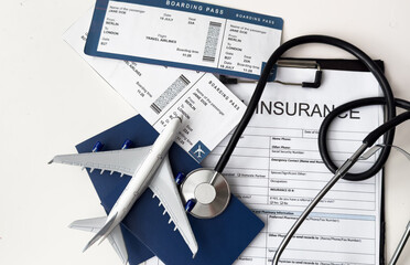 stethoscope, toy airplane on a white background. health insurance on a travel trip.