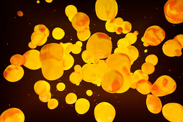 Abstract image of yellow lava lamp bubbles floating in a dark background