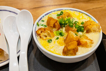 Traditional Taiwanese savory soy milk with fried crullers and green onions served at Yonghe Doujiang, showcasing local breakfast culture