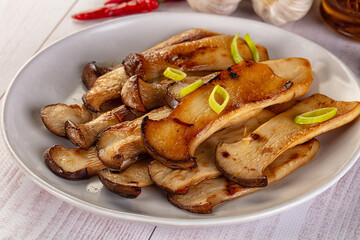 Roasted eringi mushrooms in the plate