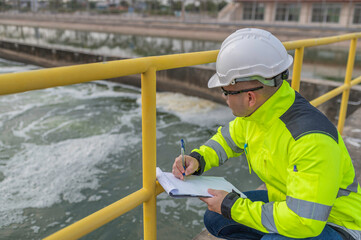 Environmental engineers work at wastewater treatment plants,Water supply engineering working at...