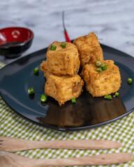 Crispy Brown Fried Tofu That Looks Crunchy And Savory With A Colorful Background Looks Very Appetizing.