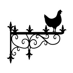 Silhouette of a chicken perched on an ornate wrought iron bracket