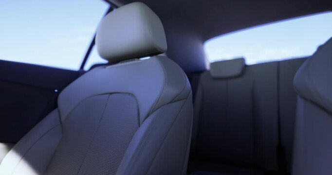 A contemporary car interior shows a single seat with sleek fabric and a minimalist design. Soft light enters through the windows, creating a calm atmosphere.