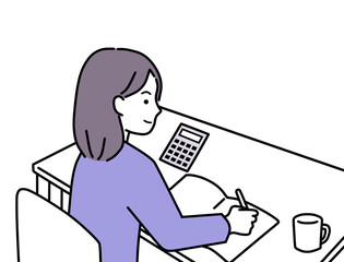 電卓を使って家計簿をつけている女性
