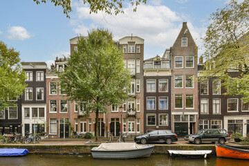 Quaint canal scene showcasing elegant architecture, flourishing trees, and boats nestled along the...