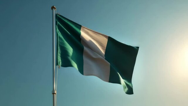 Waving Nigeria flag on flag pole with sky on background 4K