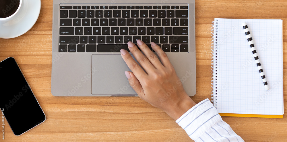 Poster marketing, design. overhead of office worker typing on pc with white display for mock up and holding