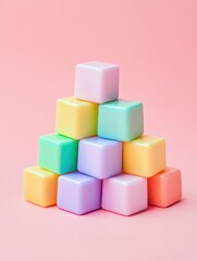 Obraz premium Pastel Cubes Stacked in Pyramid Formation on Pink Background Minimalist Composition Studio Shot