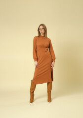 Serie of studio photos of female model in knitted beige midi dress, autumn winter fashion collection