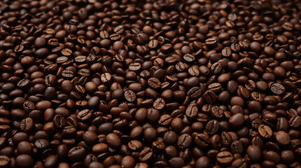 close-up of a pile of dark roasted coffee beans.