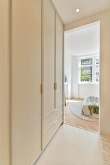 A sleek and modern interior design showcases a minimalist room featuring light colors, a spacious layout, and contemporary furniture for a calming atmosphere.