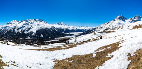 Panorama of the Upper Engadine and the lakes, with ski slopes and ski lifts, in Champfére.