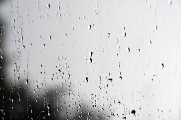 Rain drops on window glasses surface.