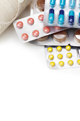 The pills with medicines on a white background