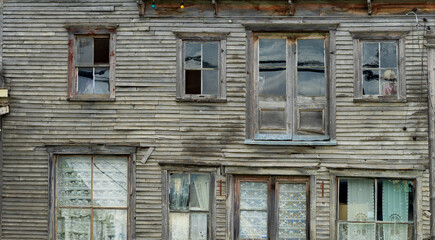 old wooden house with different windows