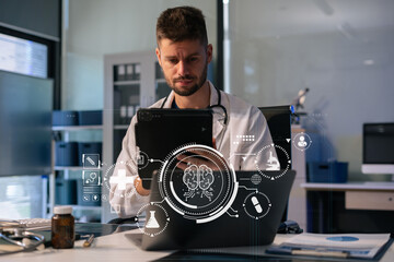Medicine doctor hand working with modern digital tablet and laptop computer interface as medical...