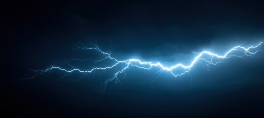 A vivid display of blue lightning illuminates the dark sky, creating striking contrasts against the cloudy backdrop. The electric energy of the summer thunderstorm captivates viewers